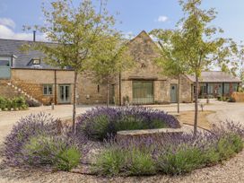 An outdoor area with lavender and trees at The Little Loft in Burford
