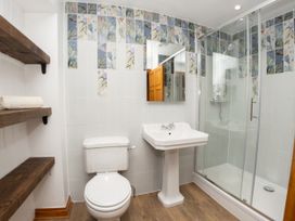 A bathroom with toilet, sink, and shower at Watermouth Castle, Bassett Apartment Berrynarbor near Ilfracombe