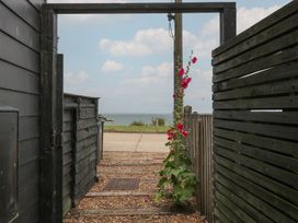 A pathway leading to the sea at The Artist's Cabin By The Sea Herne Bay