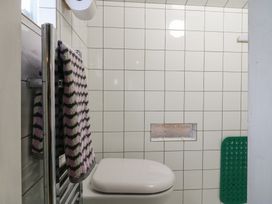 A bathroom featuring a toilet and towel rail at The Artist's Cabin By The Sea in Herne Bay