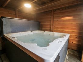 A hot tub in a wooden room at The Bevan in Bontnewydd, Gwynedd