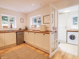 A kitchen with appliances and countertops at Mariners Rest in Gorran Haven