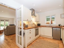 A kitchen with appliances and countertop at Mariners Rest in Gorran Haven