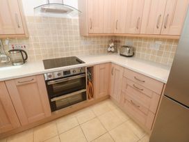 A kitchen with an oven, hob and accessories at Flat 2, Moonrakers in St. Ives