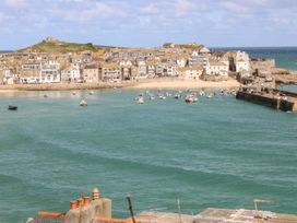 A view of a harbor with boats and buildings at Flat 2, Moonrakers St. Ives
