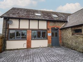 A building exterior with windows and a door at The Granary in Welshpool
