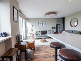 A living room with a couch and coffee table at Hafod Y Bryn Harlech