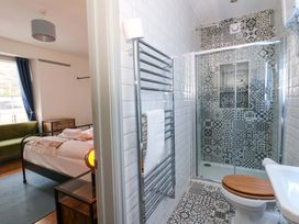 A bathroom with a shower and toilet at Island House in Aberaeron