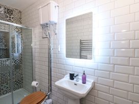 A bathroom with a sink and toilet at Island House in Aberaeron