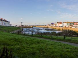 A view of houses along the waterfront at Island House Aberaeron