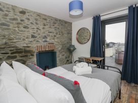 A bedroom with a bed and a view at Island House in Aberaeron