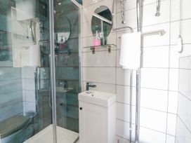 A bathroom with a shower and sink at Island House Aberaeron