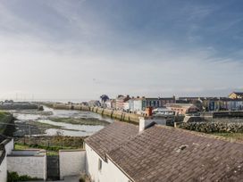 A view of a harbor and colorful houses at Island House in Aberaeron