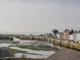 A harbor with boats and buildings at Island House in Aberaeron