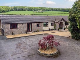 A house with garden and walkway at Brookway Lodge in Caerwys