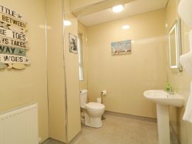 A bathroom with a sink and toilet at Duffy Lodge in Kilmacloo near Creeslough, County Donegal