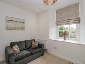 A living room with a sofa and window at Ullswater in Ulverston