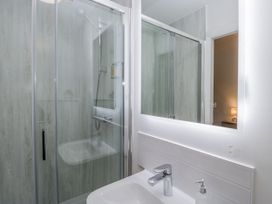 A bathroom with a shower and sink at Ullswater in Ulverston