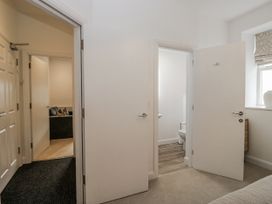 A bathroom with a toilet visible from the hallway at Ullswater in Ulverston
