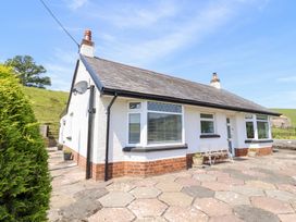 A house with windows and a pathway at Bryn Bras in Corwen