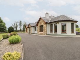 A house with stone features and a driveway at Swan Lake Cloonshaghan near Boyle, County Roscommon