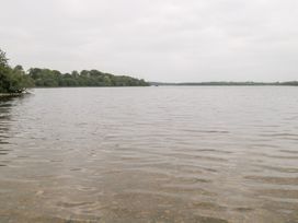 A lake with trees on the bank at Swan Lake in Cloonshaghan near Boyle, County Roscommon