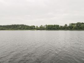 A body of water with trees along the shoreline at Swan Lake in Cloonshaghan near Boyle, County Roscommon