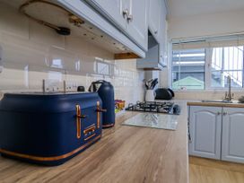 A kitchen with a kettle and toaster at Sea Lovers in Exmouth