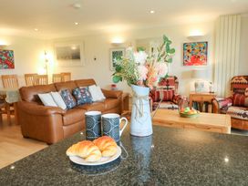 A living room with a sofa and coffee table at 5 Thurlestone Beach in Thurlestone