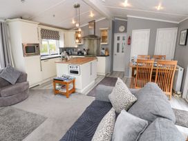 An open plan kitchen and living area at A and C Lodge-Plot 21 Armathwaite