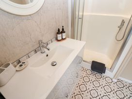 A bathroom with a sink and shower at A and C Lodge-Plot 21 Armathwaite