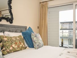 A bedroom with a bed and pillows at Whitewater Seaview in Newquay