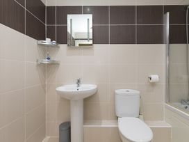 A bathroom with a sink and toilet at Whitewater Seaview in Newquay