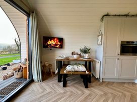 A dining area with table and chairs at Willow in Llangurig near Llanidloes