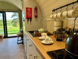 A kitchen with teapot and cups at Willow in Llangurig near Llanidloes