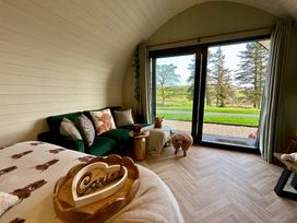 A living room with a sofa and coffee table at Willow in Llangurig near Llanidloes