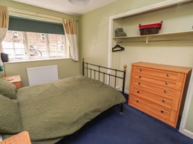 A bedroom with a bed and a drawer at Flodden Apartment in Wooler