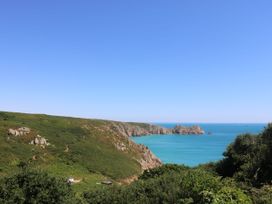 A coastline view with sea and cliffs at Fair View in St Just in Roseland near St Mawes