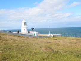 A lighthouse near the ocean at Fair View St Just in Roseland near St Mawes