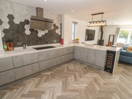 A kitchen with a countertop and appliances at Carnon Gwel, Devoran