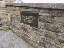 A stone wall with a sign reading Doonalton House at Doonalton House Dromore West, County Sligo