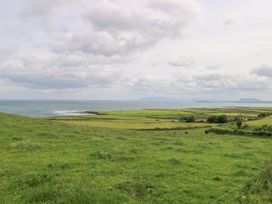 A landscape view of fields and ocean at Doonalton House in Dromore West, County Sligo