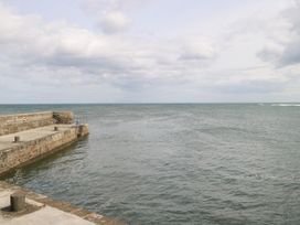 A view of a pier extending into the ocean at Doonalton House in Dromore West, County Sligo