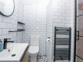 A bathroom with a sink and toilet at East meets West in Criccieth