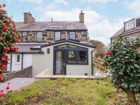 A house with garden and pathway at East meets West Criccieth