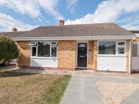 A house with a black front door and windows at No 8 Burnham-on-Sea