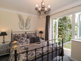 A bedroom with a bed and a window at No 8 Burnham-on-Sea