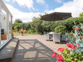 A garden with patio furniture and plants at No 8 Burnham-on-Sea