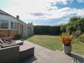 A garden with a patio sofa and planter at No 8 Burnham-on-Sea