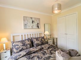 A bedroom with a bed and lamp at No 8 Burnham-on-Sea